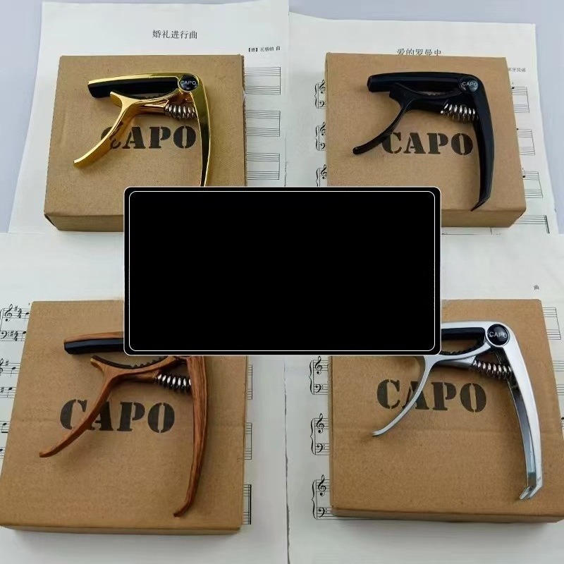Capotasto per Chitarra in Meta - Musical Instrument Ending In A recensione e prezzo